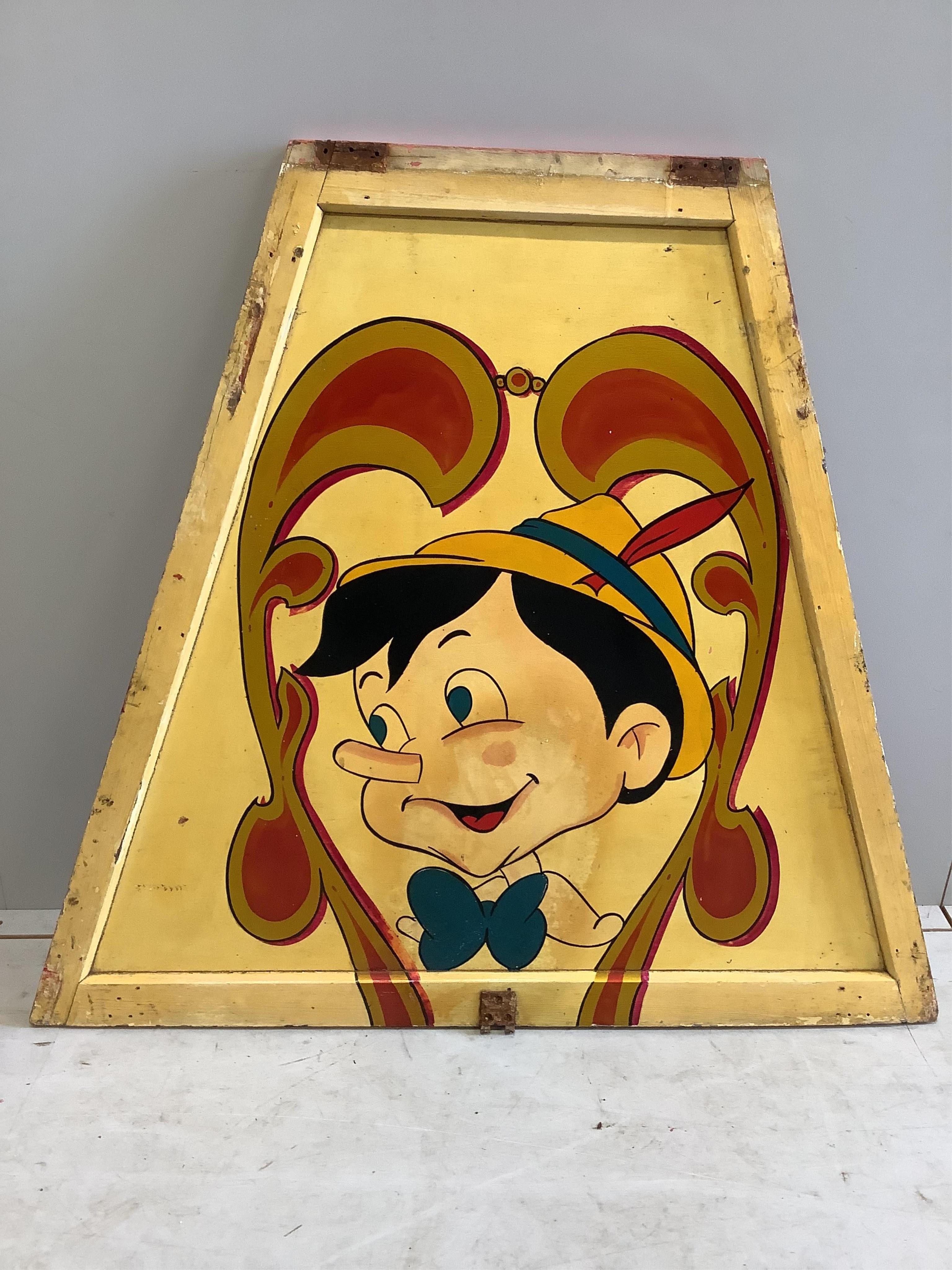 A mid century “Pinocchio” painted wood fairground carousel panel of tapered rectangular form, width 104cm, height 94cm. Condition - fair